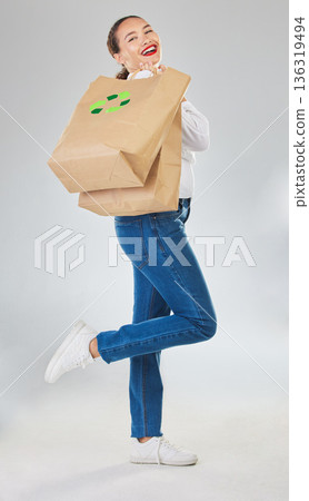 Recycling, environment and woman with bag, sustainability with shopping isolated on white background. Environmental, retail and eco friendly, female person and sustainable development in studio Recycling, environment and woman with bag, sustainability with shopping isolated on white background. Environmental, retail and eco friendly, female person and sustainable development in studio 136319494