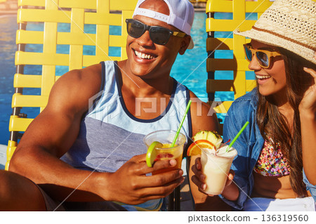 Cocktail, couple and swimming pool with sunglasses for tanning on holiday with happiness at resort. Summer, poolside with man or woman with drinks or smile to relax and enjoy at hotel with alcohol. Cocktail, couple and swimming pool with sunglasses for tanning on holiday with happiness at resort. Summer, poolside with man or woman with drinks or smile to relax and enjoy at hotel with alcohol. 136319560