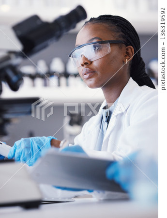 Computer, black woman or scientist reading research for online analysis, sustainability or innovation. Science, studying biotechnology or African ecology expert in a laboratory for agro development 136319592