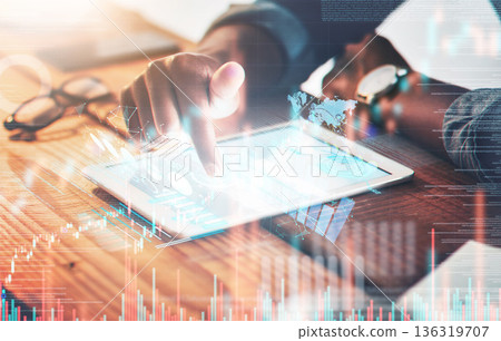 Overlay, tablet and hand of businessman on stock market, trading with data and statistics of finance, investment or profit. Mobile app, growth of money and hologram of graphs, information or fintech Overlay, tablet and hand of businessman on stock market, trading with data and statistics of finance, investment or profit. Mobile app, growth of money and hologram of graphs, information or fintech 136319707
