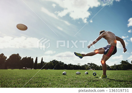 Man, field and kick rugby ball for sport with red glow, knee and injury on grass with pain for fitness. Athlete guy, overlay for joint pain, power and workout for contest, competition and development 136319731