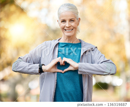 Portrait, fitness and senior woman in heart sign for self care, cardiology and workout health or support outdoor. Elderly runner, sports person or athlete for love emoji, training or wellness at park Portrait, fitness and senior woman in heart sign for self care, cardiology and workout health or support outdoor. Elderly runner, sports person or athlete for love emoji, training or wellness at park 136319887
