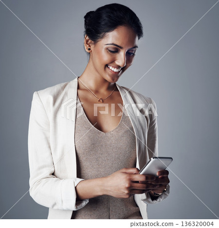 Corporate, smile and woman with a smartphone, social media and search internet on a grey studio background. Female person, entrepreneur and model with a cellphone, website information and connection Corporate, smile and woman with a smartphone, social media and search internet on a grey studio background. Female person, entrepreneur and model with a cellphone, website information and connection 136320004