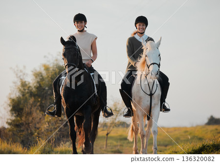 Horse ride, woman friends and countryside portrait with animal, calm and freedom on holiday and travel. Equestrian, people and field trip with pet in nature on vacation with rider outdoor on ranch Horse ride, woman friends and countryside portrait with animal, calm and freedom on holiday and travel. Equestrian, people and field trip with pet in nature on vacation with rider outdoor on ranch 136320082