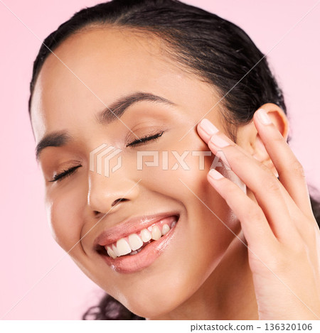Beauty, skin cream and face of a woman in studio for cosmetics, dermatology and glow. Headshot, moisturizer and natural skincare of a young female aesthetic model on a pink background with a smile Beauty, skin cream and face of a woman in studio for cosmetics, dermatology and glow. Headshot, moisturizer and natural skincare of a young female aesthetic model on a pink background with a smile 136320106