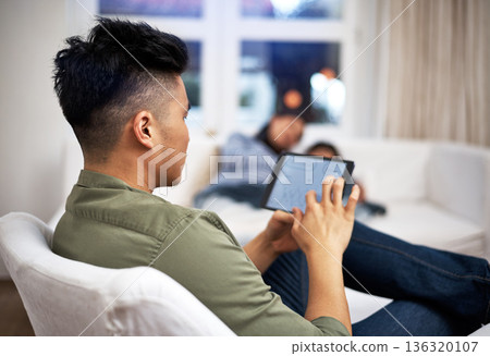 Man, tablet and remote work on couch in family home with review, charts and screen in living room. Person, graphs and click with tech, application and insight with project in lounge at apartment Man, tablet and remote work on couch in family home with review, charts and screen in living room. Person, graphs and click with tech, application and insight with project in lounge at apartment 136320107
