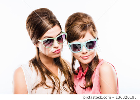 Fashion, vintage and sunglass with portrait of women in studio for elegant, pastel and beauty. Retro, confident and cosmetics with female model on dark background for glamour, beehive and style Fashion, vintage and sunglass with portrait of women in studio for elegant, pastel and beauty. Retro, confident and cosmetics with female model on dark background for glamour, beehive and style 136320193