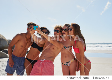 Selfie, beach and group of friends for summer, holiday and vacation in bikini, social media post and content creation. Happy young people or men and women in profile picture or digital memory at sea Selfie, beach and group of friends for summer, holiday and vacation in bikini, social media post and content creation. Happy young people or men and women in profile picture or digital memory at sea 136320235