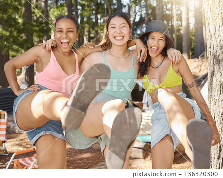 Friends, camping and portrait of happy women in nature for adventure, freedom and holiday outdoors. Friendship, hiking and people kick in woods, forest and mountain for travel, vacation and trekking 136320300