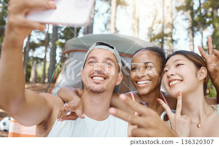Happy, peace sign and selfie of friends camping in forest, woods or nature together. Smile, v hand and people taking picture for hiking, social media emoji or group memory outdoor on summer vacation. 136320307