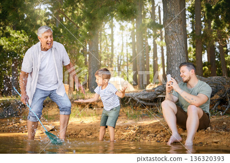 Nature, lake and child with his grandfather and father playing, fishing and bonding on a vacation. Travel, happy and senior man having fun with adult son and grandchild in the woods on a weekend trip Nature, lake and child with his grandfather and father playing, fishing and bonding on a vacation. Travel, happy and senior man having fun with adult son and grandchild in the woods on a weekend trip 136320393
