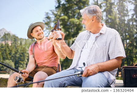 Fishing, lake and senior male or son with drink for happiness or adventure at forest on vacation. Hobby, river and rod with man and grandfather with beer on holiday together for bonding in nature. Fishing, lake and senior male or son with drink for happiness or adventure at forest on vacation. Hobby, river and rod with man and grandfather with beer on holiday together for bonding in nature. 136320404