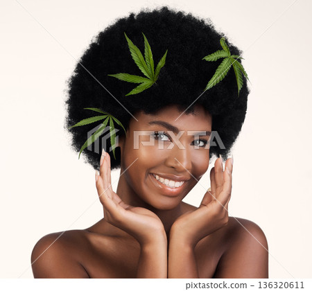 Black woman, leaves and marijuana in studio portrait, pride and organic skincare by white background. African girl, model or hemp for beauty, makeup or glow on skin for aesthetic, afro and cosmetics Black woman, leaves and marijuana in studio portrait, pride and organic skincare by white background. African girl, model or hemp for beauty, makeup or glow on skin for aesthetic, afro and cosmetics 136320611
