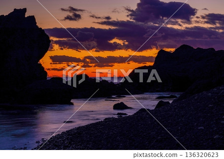 A rocky coastline and dramatic clouds bathed in the sunset at Cape Muroto A rocky coastline and dramatic clouds bathed in the sunset at Cape Muroto 136320623