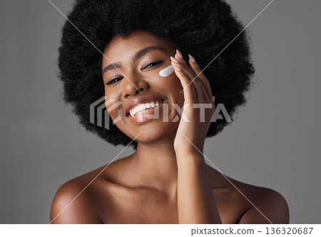 African woman, skincare cream or studio portrait with afro, face or cosmetic for smile by background. Girl, model and happy for natural self care with makeup, clean aesthetic and product for beauty 136320687