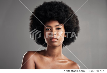 Portrait, cosmetics and black girl with confidence for dermatology in studio background. African, woman and beauty with glowing skin with makeup and afro for facial treatment for self care or shine. 136320714