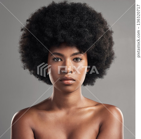 Skincare, portrait of a black woman and against a studio background for beauty cosmetics. Glowing or serious, cosmetology and face of African female person pose for confidence against a backdrop Skincare, portrait of a black woman and against a studio background for beauty cosmetics. Glowing or serious, cosmetology and face of African female person pose for confidence against a backdrop 136320717