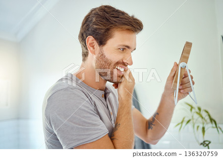 Man in bathroom, checking face in mirror and smile with morning routine, health and wellness in home. Dental care, clean mouth and teeth with male grooming for fresh breath, hygiene and getting ready 136320759