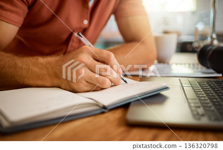 Man, hands and writing on book for notes, schedule planning or strategy on table at home. Closeup hand of male person with pen and notebook for ideas, reminder or information in research or studying Man, hands and writing on book for notes, schedule planning or strategy on table at home. Closeup hand of male person with pen and notebook for ideas, reminder or information in research or studying 136320798
