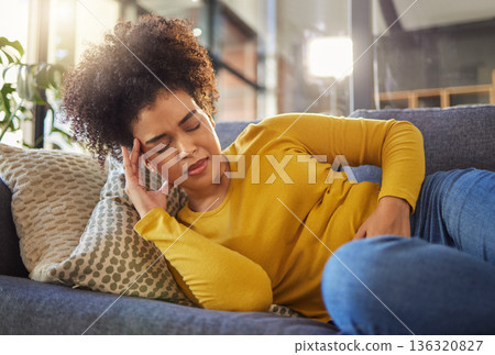 Stomach pain, digestion and menstruation with woman on sofa for healthcare, endometriosis and tired. Sick, medical and constipation with person in living room at home for nausea, virus and fear 136320827