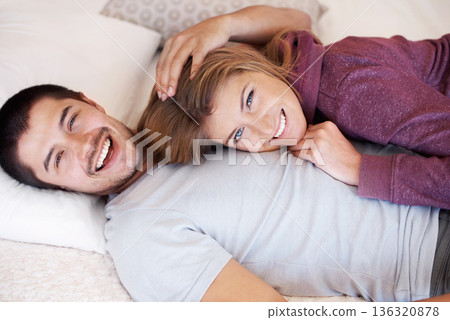 Love, portrait and happy couple on bed from above to relax, bonding and spending quality time together in home. Relationship, man and woman in bedroom with romance, embrace and smile in apartment. 136320878