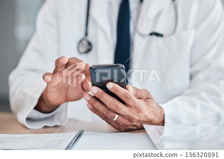 Smartphone, hands and doctor typing at table in hospital for research, telehealth or healthcare. Phone, medical professional or surgeon, expert or person on wellness app, email or online consultation Smartphone, hands and doctor typing at table in hospital for research, telehealth or healthcare. Phone, medical professional or surgeon, expert or person on wellness app, email or online consultation 136320891