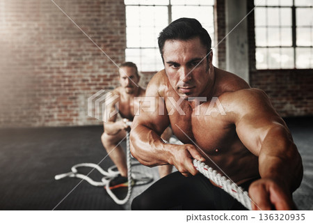 Men, gym and pull rope for exercise with strong muscle, coaching or teamwork for health, self care and together. Body builder partnership, focus and tug of war for workout, health or support on floor Men, gym and pull rope for exercise with strong muscle, coaching or teamwork for health, self care and together. Body builder partnership, focus and tug of war for workout, health or support on floor 136320935