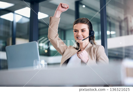 Happy woman, laptop and fist in call center for celebration, winning or victory and bonus promotion at office. Female person, consultant or agent in joy for achievement, discount or sale at workplace 136321025