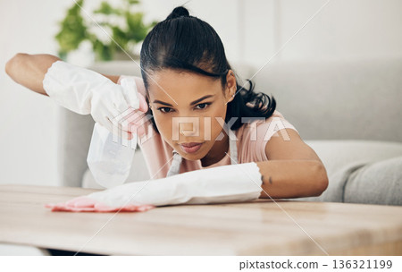 Woman, chemical spray and cleaning wooden table, hygiene with household maintenance and detergent. Female cleaner, disinfectant and wipe or clean dirt with cloth from surface and janitor service 136321199