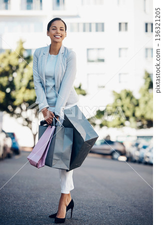 Happy woman, portrait and shopping bag in city street for fashion, style or purchase in the outdoors. Female person or shopper with smile for luxury spree on road in stylish clothing in an urban town Happy woman, portrait and shopping bag in city street for fashion, style or purchase in the outdoors. Female person or shopper with smile for luxury spree on road in stylish clothing in an urban town 136321205