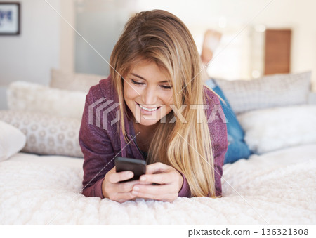 Teenager, girl and smartphone with social media and relax in bedroom, smile with technology and communication. Young female person at home, using phone and mobile app with happiness, gen z and chat Teenager, girl and smartphone with social media and relax in bedroom, smile with technology and communication. Young female person at home, using phone and mobile app with happiness, gen z and chat 136321308