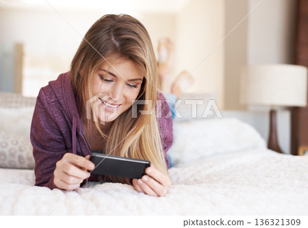 Teenager, girl and smartphone, watching film and relax in bedroom, technology and streaming service. Young female person at home, movie subscription and mobile app with happiness, gen z and internet Teenager, girl and smartphone, watching film and relax in bedroom, technology and streaming service. Young female person at home, movie subscription and mobile app with happiness, gen z and internet 136321309