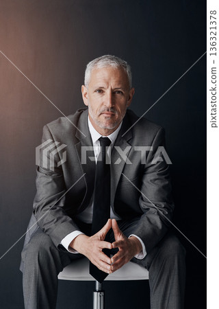Mockup, chair and serious portrait of businessman, lawyer or attorney, confidence on dark background and studio. Boss, ceo and professional business owner, proud senior executive director at law firm Mockup, chair and serious portrait of businessman, lawyer or attorney, confidence on dark background and studio. Boss, ceo and professional business owner, proud senior executive director at law firm 136321378