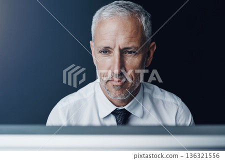 Thinking, idea and mature businessman working on a project with a computer or technology. Career, brainstorming and professional senior male person doing corporate research on a desktop in workplace. Thinking, idea and mature businessman working on a project with a computer or technology. Career, brainstorming and professional senior male person doing corporate research on a desktop in workplace. 136321556