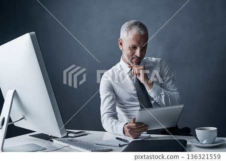 Tablet, thinking and senior business man in studio isolated on a dark background mockup. Technology, planning and happy manager at desk for idea, problem solving or reading for solution in company. 136321559