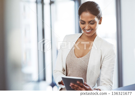 Tablet, accountant and happy woman in office for business, research or online browsing. Smile, digital technology and corporate Indian auditor reading email, internet app or website info in company. Tablet, accountant and happy woman in office for business, research or online browsing. Smile, digital technology and corporate Indian auditor reading email, internet app or website info in company. 136321677