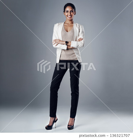 Happy, arms crossed and portrait of business woman in studio for professional, natural or confidence. Smile, corporate and career with female employee on grey background for manager and pride Happy, arms crossed and portrait of business woman in studio for professional, natural or confidence. Smile, corporate and career with female employee on grey background for manager and pride 136321707