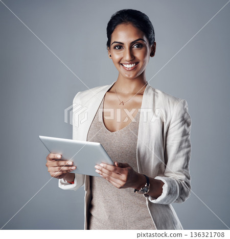 Technology, portrait of a woman with a tablet and against a studio background for social networking. Online communication or connectivity, happy and businesswoman reading or writing an email Technology, portrait of a woman with a tablet and against a studio background for social networking. Online communication or connectivity, happy and businesswoman reading or writing an email 136321708