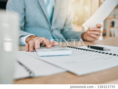 Accounting paperwork, hands and calculator for an audit, finance administration or planning report. Desk, work and an accountant with documents in an office for analysis, bookkeeping or budget Accounting paperwork, hands and calculator for an audit, finance administration or planning report. Desk, work and an accountant with documents in an office for analysis, bookkeeping or budget 136321735
