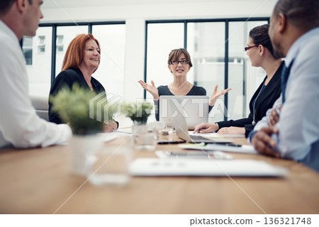 Questions, meeting and business people with laptop for planning, collaboration and strategy discussion in office. Teamwork, brainstorming and designer team share idea for solution or problem solving 136321748