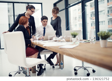 Discussion, meeting and business people in the office planning, brainstorming and doing research. Teamwork, professional and group of designers working on a project in collaboration in the workplace. 136321752