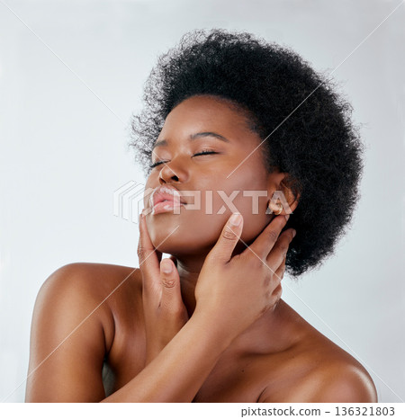 Afro, beauty and skincare with black woman or cosmetics in studio background for glow. Natural, face and hand with african girl for haircare or treatment, shine for self love or wellness in mock up. 136321803