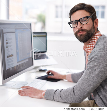 Business man, serious portrait and computer coding of a IT professional at an office desk. Typing, cyber company and digital website design of an employee with pc technology at a startup workplace 136321804