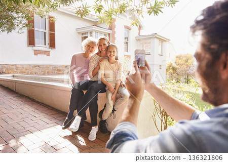 Picture, family and happy grandma, mother and child bonding, smile and father taking outdoor generations photo. Cellphone, support and happiness of young kid, mom and elderly grandma in home backyard 136321806