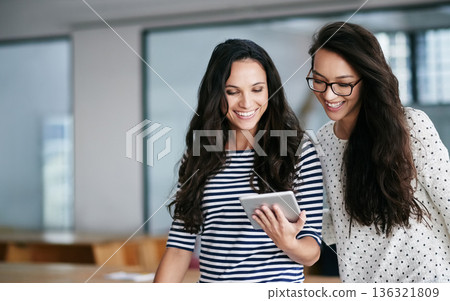 Happy, women and tablet for creative planning, designer and collaboration in office. Research, smile and female online for graphic design, social media and idea, checking and app development 136321809