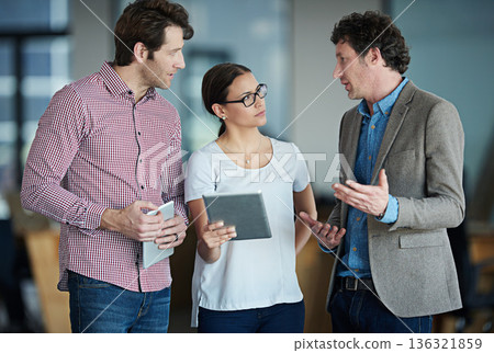 Team discussion, tablet or business people with ideas or research in group meeting talking together. Diversity, collaboration or employees speaking of technology data or digital network in office 136321859