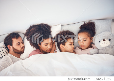 Sleeping, above and family in a bed with love, dreaming and resting in their home cosy together. Sleep, top view and children with parents in a bedroom nap, peaceful and hugging, comfort and bond Sleeping, above and family in a bed with love, dreaming and resting in their home cosy together. Sleep, top view and children with parents in a bedroom nap, peaceful and hugging, comfort and bond 136321989