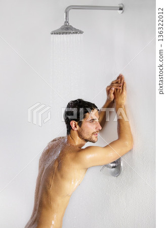 Shower, man rest and bathroom with body cleaning and soap in the morning in home. Water, young male person and smile with hygiene and clean skin care in house with cosmetic grooming and shaving foam Shower, man rest and bathroom with body cleaning and soap in the morning in home. Water, young male person and smile with hygiene and clean skin care in house with cosmetic grooming and shaving foam 136322012
