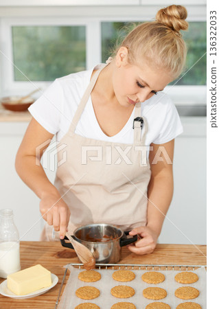 Woman, kitchen or chef baking cookies with dough or pastry pot in a bakery shop with a dessert recipe. Food business, start or girl baker working in preparation of a sweet meal, cake or biscuits Woman, kitchen or chef baking cookies with dough or pastry pot in a bakery shop with a dessert recipe. Food business, start or girl baker working in preparation of a sweet meal, cake or biscuits 136322033