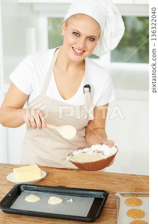 Happy woman, portrait or chef baking cookies with dough or pastry in a bakery kitchen with recipe. Food business, dessert tray or girl baker working in preparation of a sweet meal, cake or biscuit 136322040